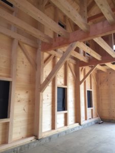 The inside of a timber frame building under construction. Photo by Erin Connolly.